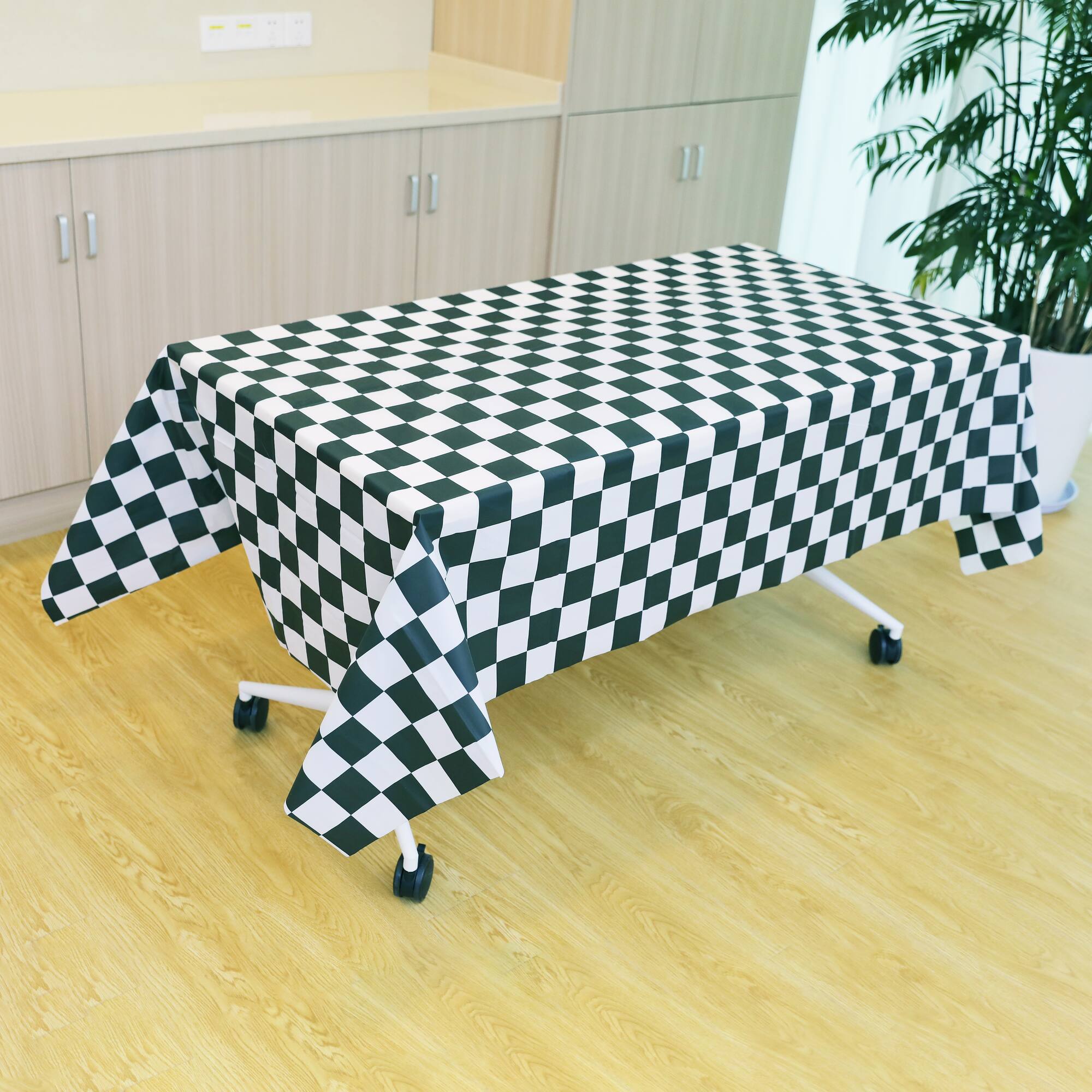 54" x 108" Black & White Checker Plastic Table Cover by Celebrate It™